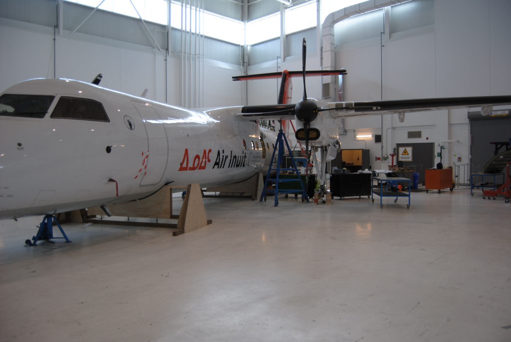 The aircraft is sitting on jigs made of wood