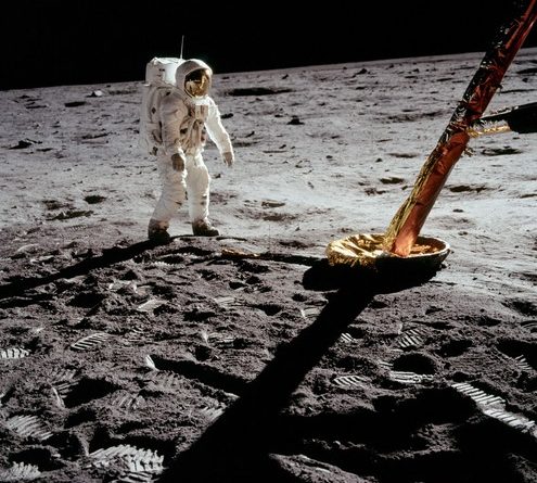 Buzz Aldrin walking the candying gear of the LM